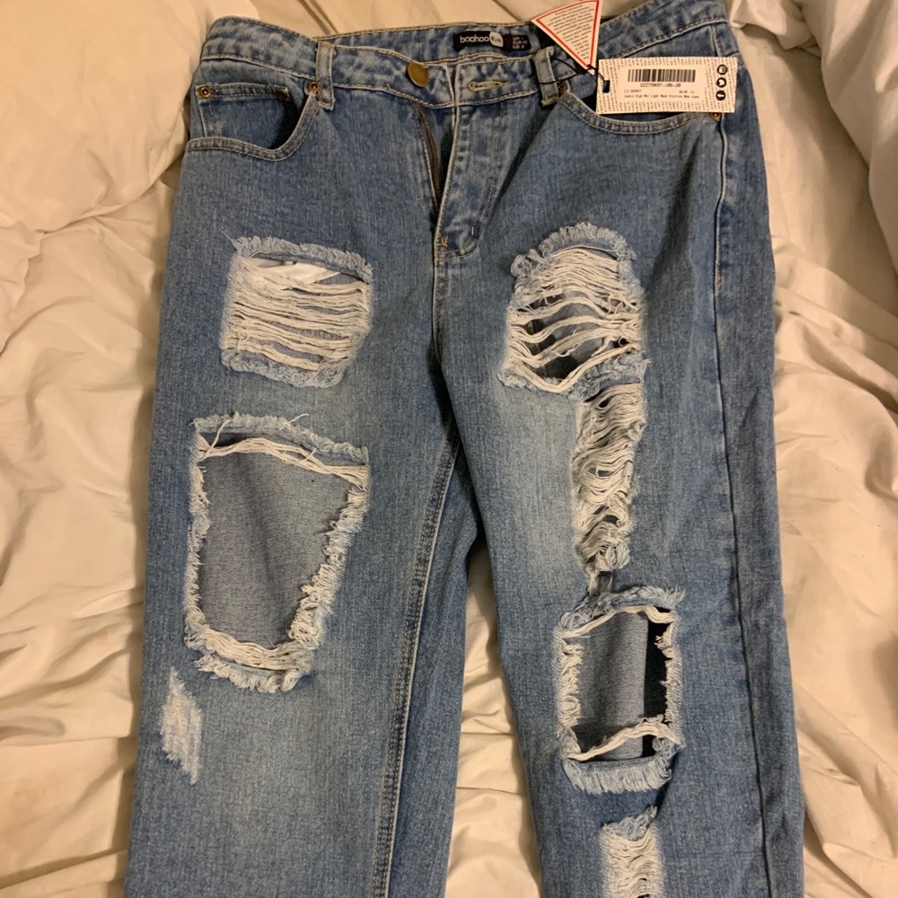 Distressed light wash mom jeans.